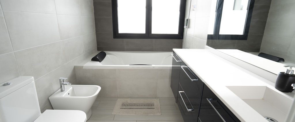 a bathroom with a tub toilet and sink