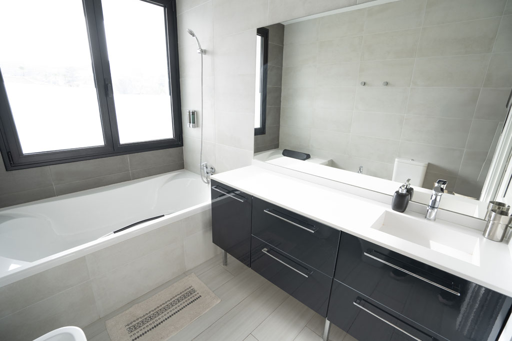 a bathroom with a tub and sink
