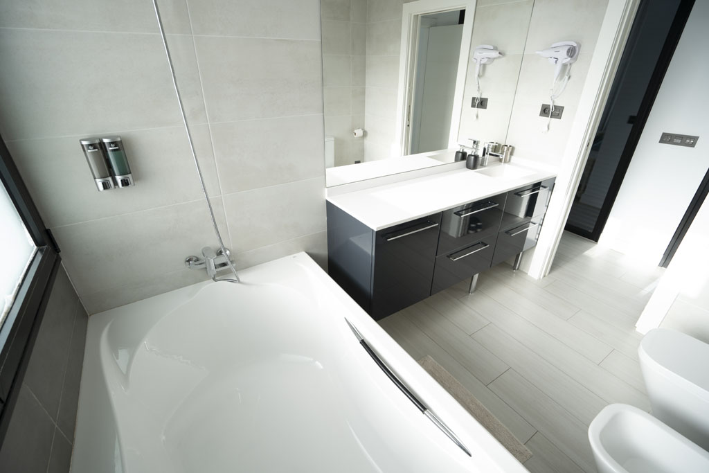 a bathroom with a bathtub and sink