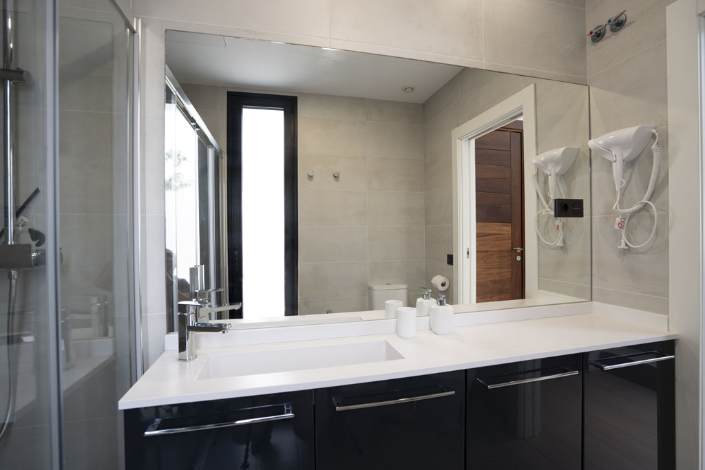a bathroom with a mirror and sink
