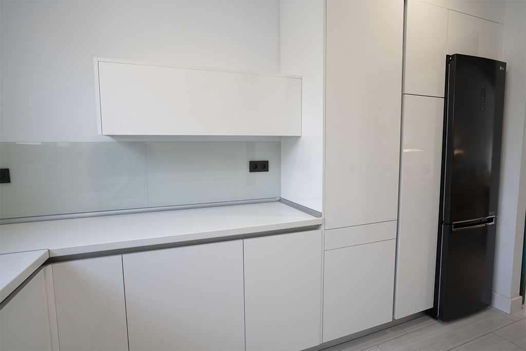 a white kitchen with white cabinets
