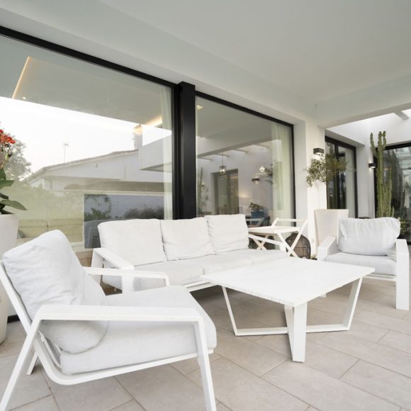 a white furniture on a patio