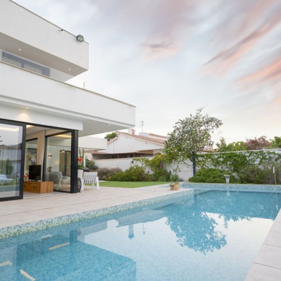 a pool outside of a house