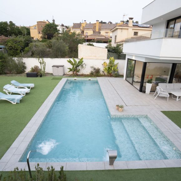 a swimming pool and a house